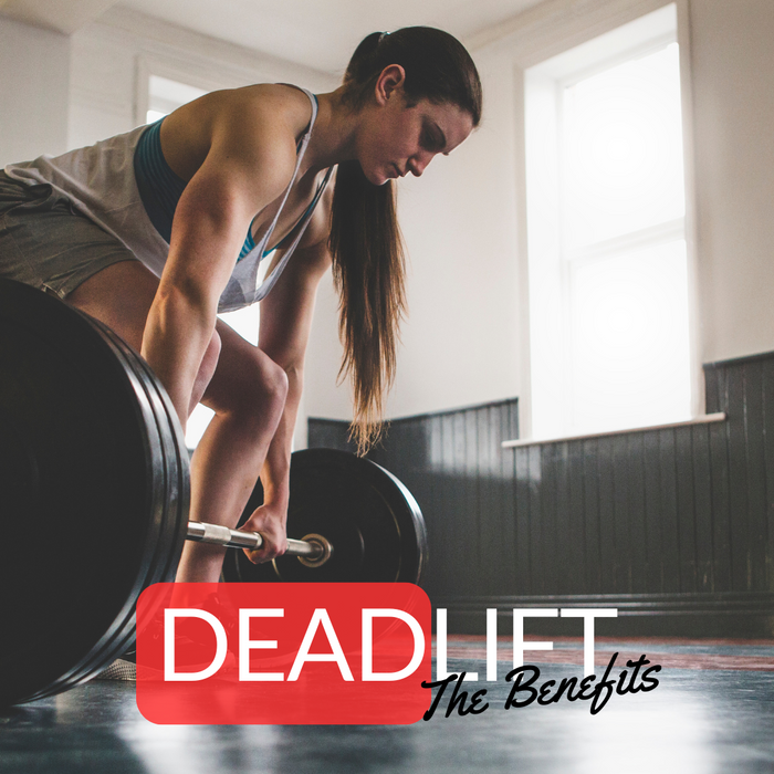 a woman in the gym doing a deadlift