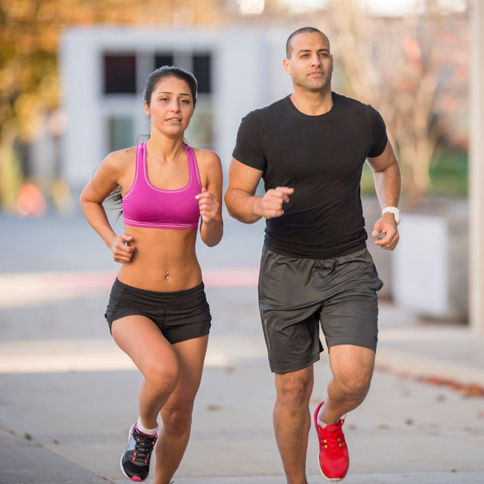 2 people getting fit running down the street