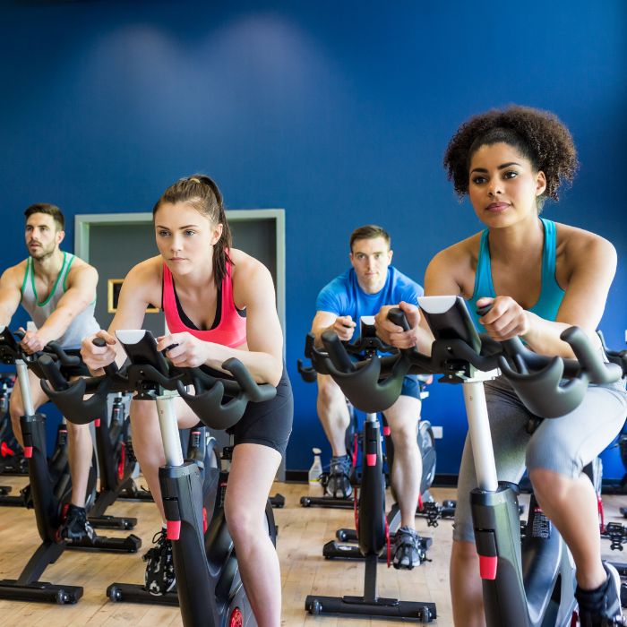 4 young people in a spin class