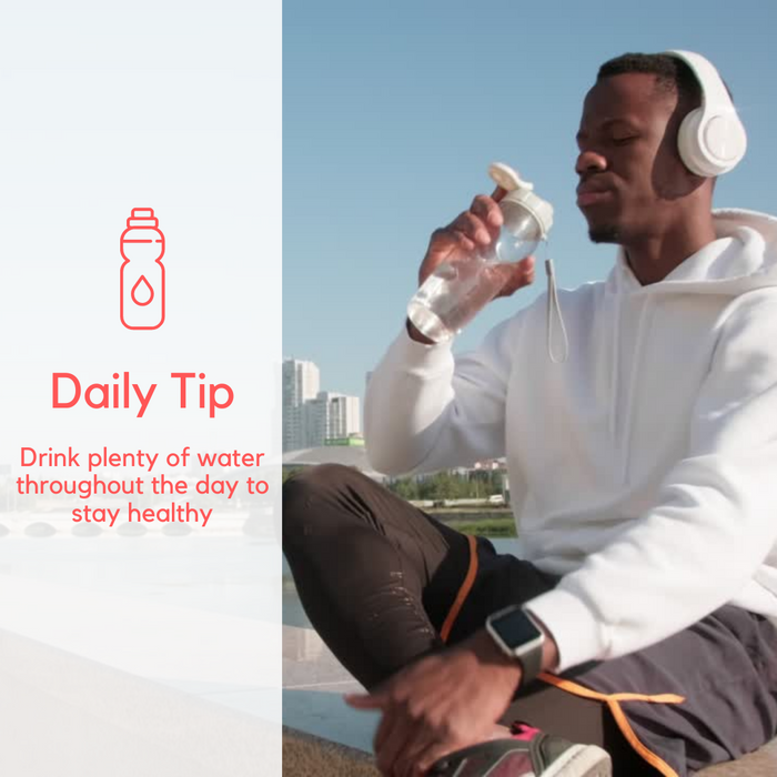 A black guy with headphones into fitness drinking water