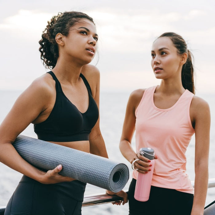 two women doing fitness thinking