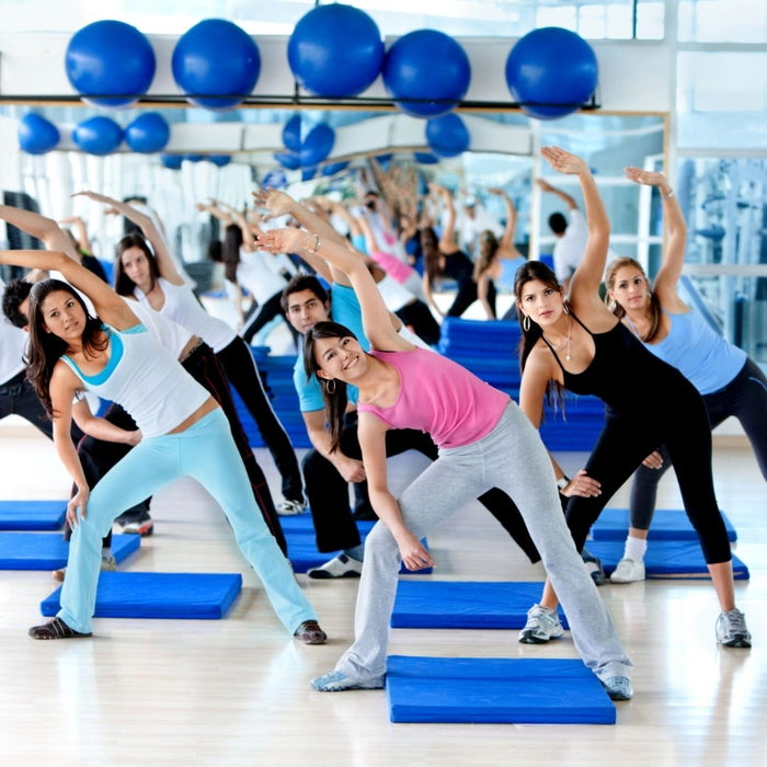 a group exercising in a gym