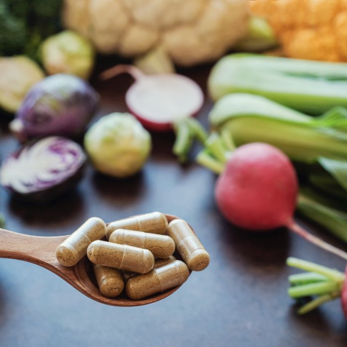 supplements with vegetables in the background