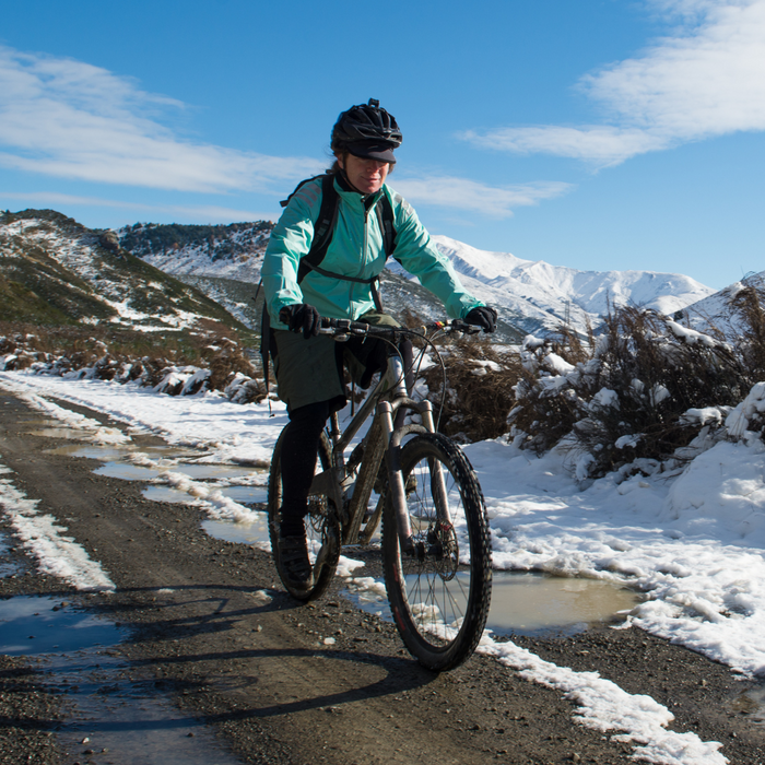 a women on a bike in the snow